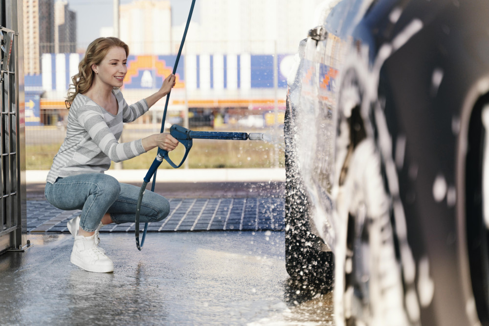 woman-washing-her-car-outdoors_1690868742.jpg